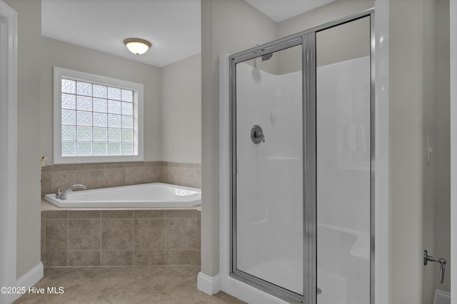 1306 Wakefield Ct, Winnabow, NC 28479 - bathroom featuring a shower stall, a bath, tile patterned flooring, and baseboards