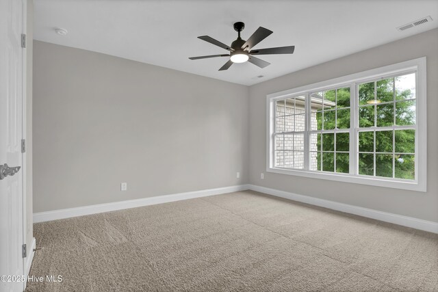 1306 Wakefield Ct, Winnabow, NC 28479 - carpeted empty room with baseboards, a ceiling fan, and a smoke detector