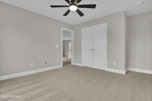 1306 Wakefield Ct, Winnabow, NC 28479 - unfurnished bedroom featuring carpet, baseboards, a closet, and ceiling fan