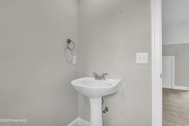 1306 Wakefield Ct, Winnabow, NC 28479 - bathroom with baseboards and a sink