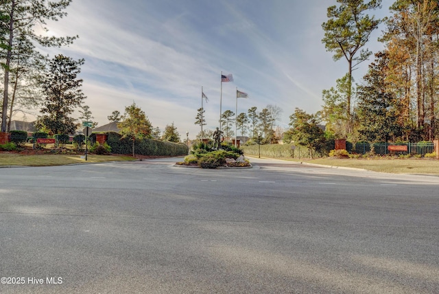 1306 Wakefield Ct, Winnabow, NC 28479 - view of asphalt road with traffic signs