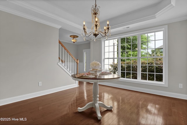1306 Wakefield Ct, Winnabow, NC 28479 - unfurnished dining area featuring crown molding, stairs, a chandelier, wood finished floors, and baseboards