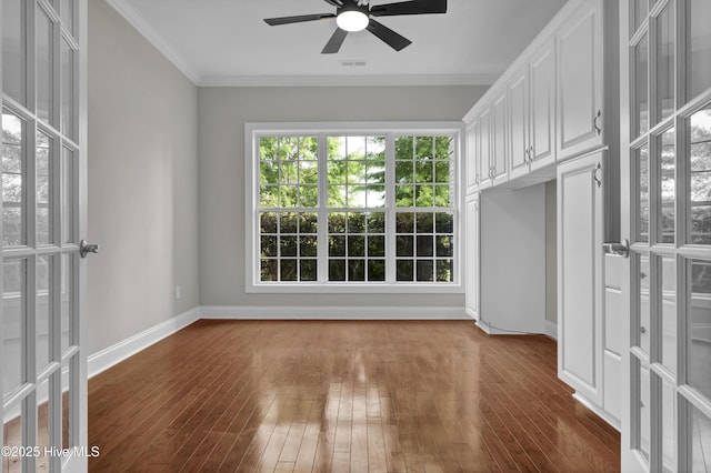 1306 Wakefield Ct, Winnabow, NC 28479 - unfurnished room with ceiling fan, dark wood-type flooring, baseboards, and crown molding