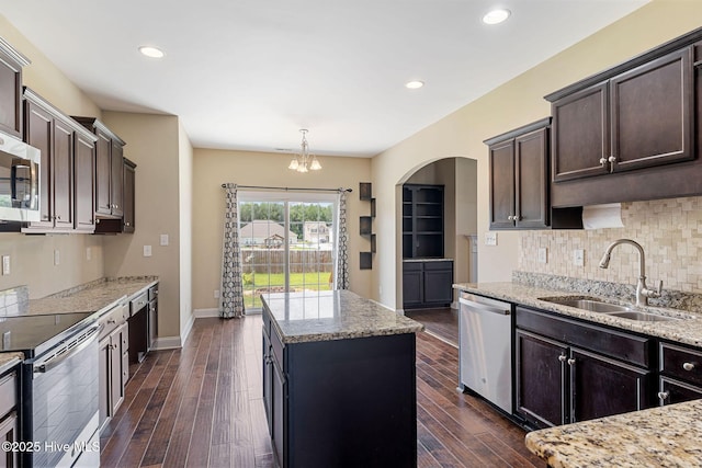 113 Kingsmill Dr, Pikeville, NC 27863 - kitchen featuring stainless steel appliances, a center island, dark wood-type flooring, dark brown cabinetry, and recessed lighting