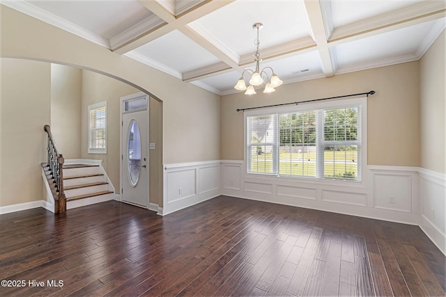 113 Kingsmill Dr, Pikeville, NC 27863 - foyer with dark wood-type flooring, a chandelier, arched walkways, beamed ceiling, and coffered ceiling