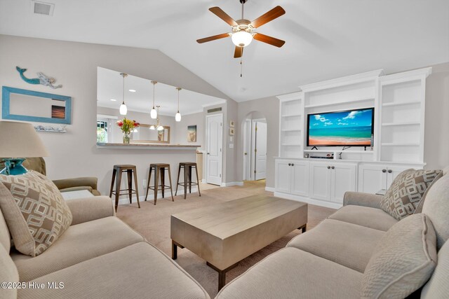 2017 Willow Stone Ct, Leland, NC 28451 - living room with light carpet, arched walkways, ceiling fan, lofted ceiling, and baseboards