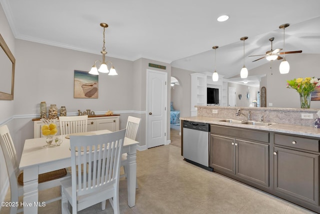 2017 Willow Stone Ct, Leland, NC 28451 - kitchen with stainless steel dishwasher, a sink, a ceiling fan, hanging light fixtures, and vaulted ceiling