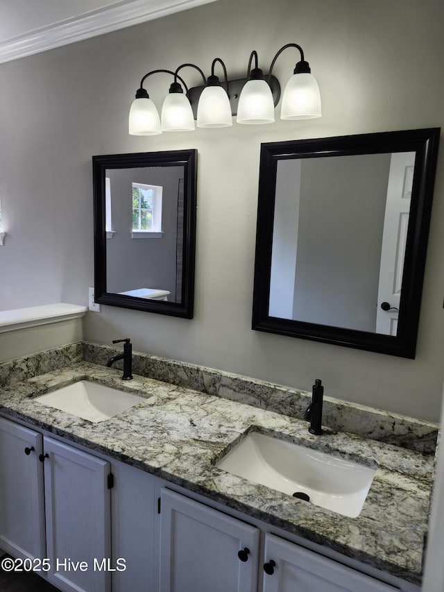 5024 Gate Post Ln, Wilmington, NC 28412 - bathroom with double vanity and crown molding