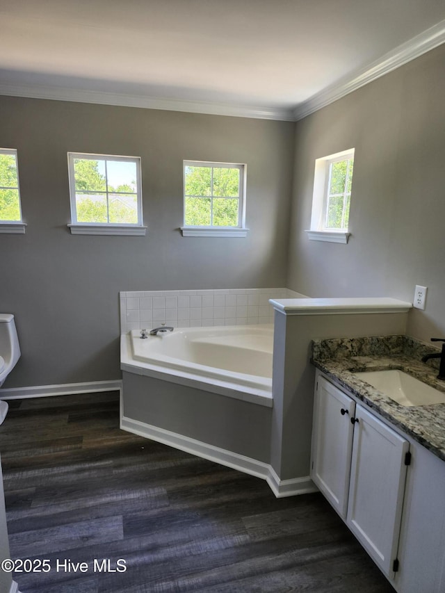 5024 Gate Post Ln, Wilmington, NC 28412 - bathroom featuring wood finished floors, a bath, healthy amount of natural light, and ornamental molding