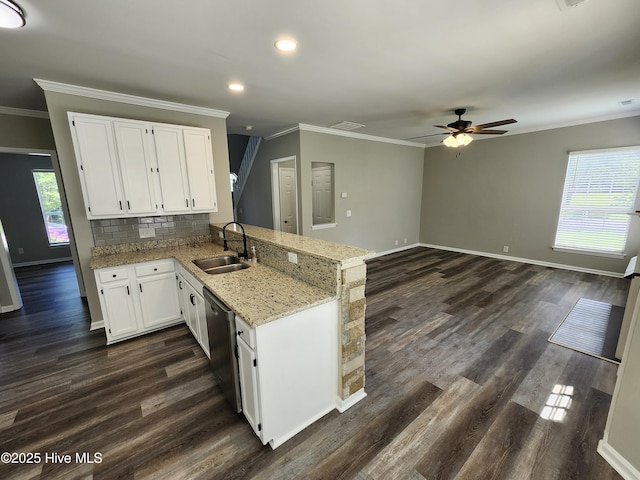 5024 Gate Post Ln, Wilmington, NC 28412 - kitchen with a sink, crown molding, a ceiling fan, stainless steel dishwasher, and a peninsula
