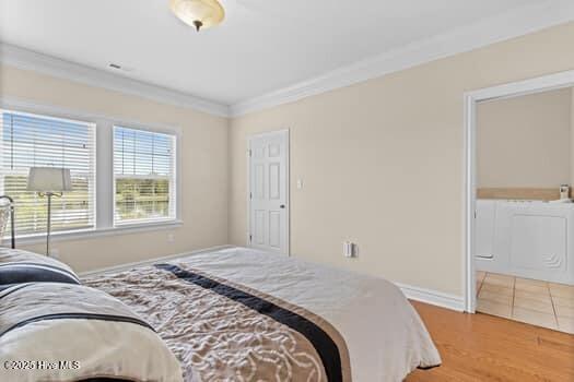 375 Summit Farms Trl, Moyock, NC 27958 - bedroom featuring crown molding, baseboards, and wood finished floors