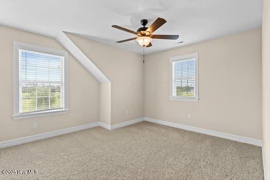 375 Summit Farms Trl, Moyock, NC 27958 - unfurnished room with healthy amount of natural light, carpet flooring, ceiling fan, and baseboards