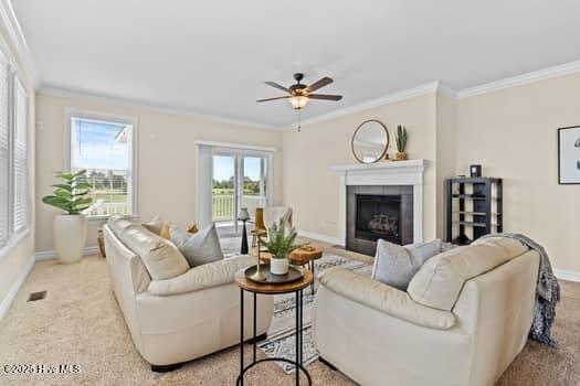 375 Summit Farms Trl, Moyock, NC 27958 - living room featuring crown molding, baseboards, ceiling fan, a fireplace, and carpet
