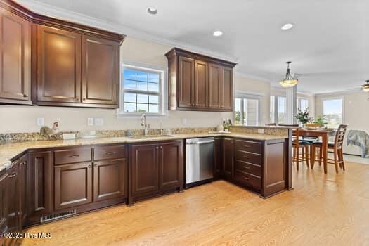 375 Summit Farms Trl, Moyock, NC 27958 - kitchen with dishwasher, a sink, plenty of natural light, light wood-style flooring, and ornamental molding