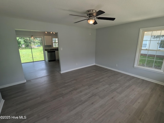 2527 Country Club Rd, Jacksonville, NC 28546 - unfurnished room with ceiling fan, dark wood-type flooring, a textured ceiling, and a chandelier