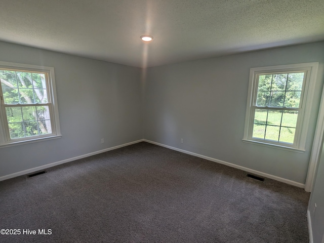 2527 Country Club Rd, Jacksonville, NC 28546 - spare room with dark colored carpet and a textured ceiling