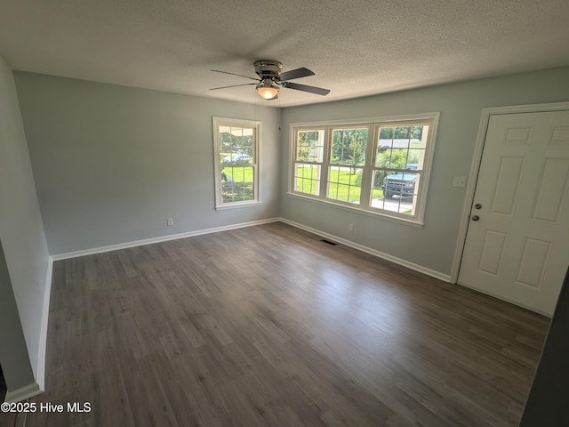 2527 Country Club Rd, Jacksonville, NC 28546 - spare room with a ceiling fan, dark wood-type flooring, and a textured ceiling