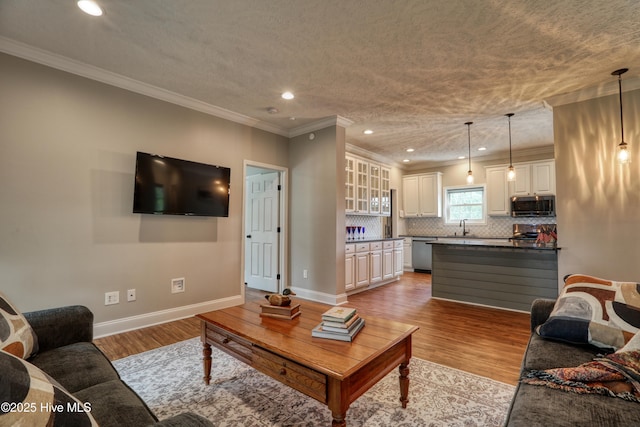 60 Pine Lake Rd, Southport, NC 28461 - living room featuring light wood-type flooring, baseboards, crown molding, and recessed lighting