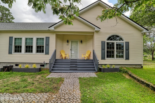 60 Pine Lake Rd, Southport, NC 28461 - bungalow-style home with a front lawn