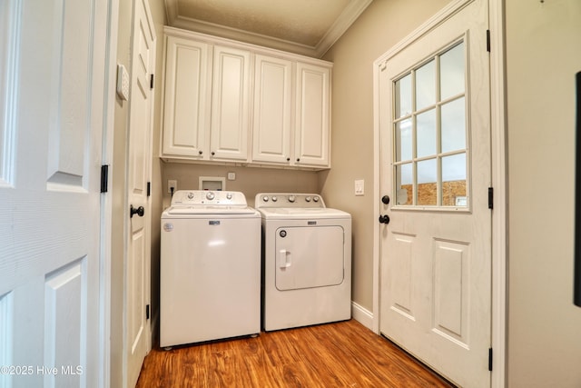 60 Pine Lake Rd, Southport, NC 28461 - laundry area featuring cabinet space, separate washer and dryer, ornamental molding, wood finished floors, and baseboards