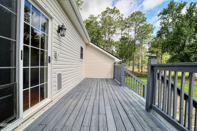 60 Pine Lake Rd, Southport, NC 28461 - deck with view of wooded area