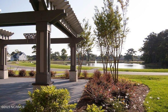 482 Sailor Sky Way Unit 401, Hampstead, NC 28443 - view of property's community with a water view and a lawn