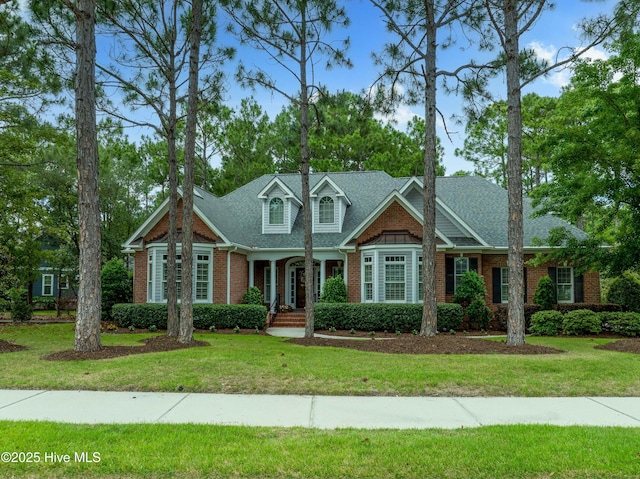 3792 Bancroft Pl, Southport, NC 28461 - view of front of property featuring brick siding and a front yard