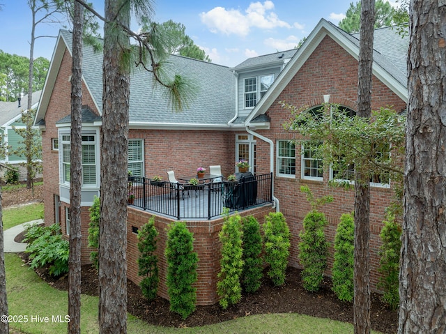 3792 Bancroft Pl, Southport, NC 28461 - rear view of house with brick siding and a shingled roof