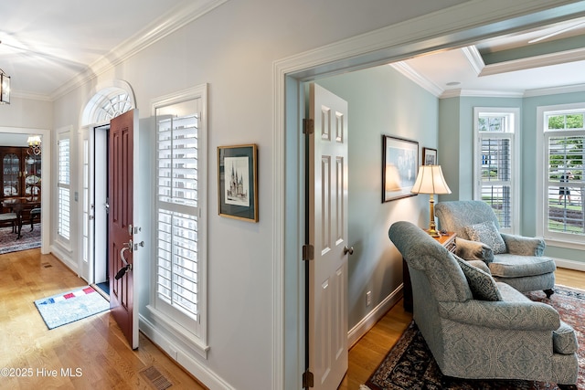 3792 Bancroft Pl, Southport, NC 28461 - foyer featuring light wood finished floors, ornamental molding, and baseboards