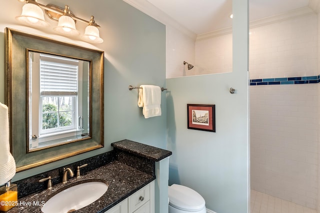 3792 Bancroft Pl, Southport, NC 28461 - full bathroom featuring vanity, a tile shower, toilet, and crown molding