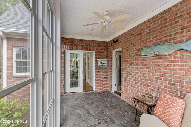 3792 Bancroft Pl, Southport, NC 28461 - unfurnished sunroom with a ceiling fan and plenty of natural light