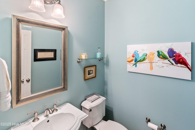 3792 Bancroft Pl, Southport, NC 28461 - bathroom featuring toilet and a sink