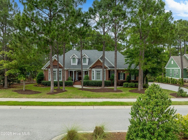 3792 Bancroft Pl, Southport, NC 28461 - view of front of property featuring brick siding and a front lawn