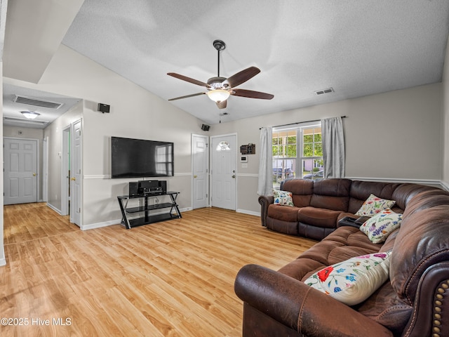 245 Parnell Rd, Hubert, NC 28539 - living area featuring a ceiling fan, wood finished floors, lofted ceiling, baseboards, and a textured ceiling