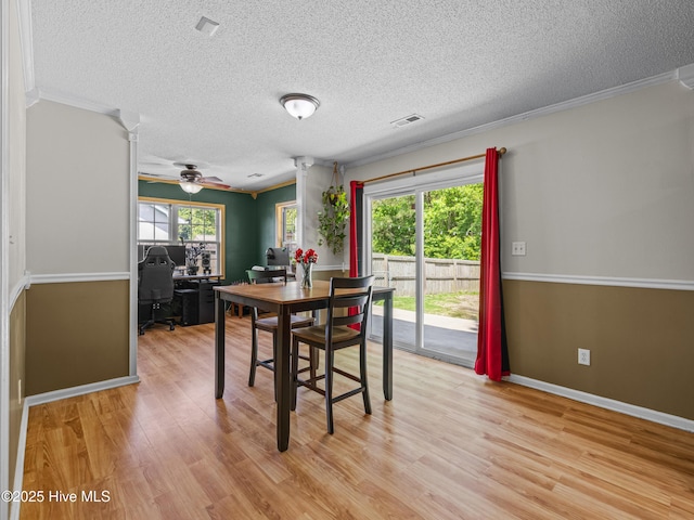 245 Parnell Rd, Hubert, NC 28539 - dining room with a desk, a textured ceiling, light wood-style floors, crown molding, and baseboards