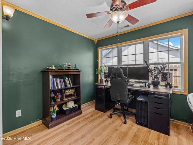 245 Parnell Rd, Hubert, NC 28539 - home office featuring wood finished floors, plenty of natural light, a ceiling fan, a textured ceiling, and crown molding