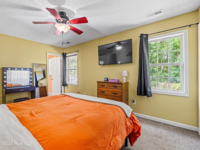 245 Parnell Rd, Hubert, NC 28539 - carpeted bedroom with baseboards, a textured ceiling, and a ceiling fan
