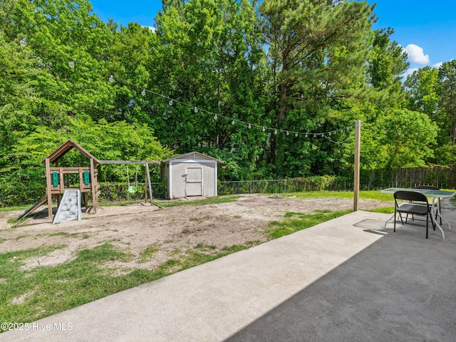 245 Parnell Rd, Hubert, NC 28539 - fenced backyard featuring a playground and a patio area