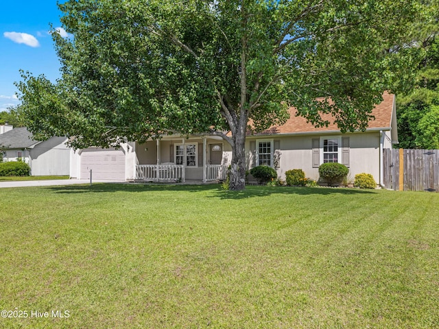 245 Parnell Rd, Hubert, NC 28539 - view of front of home with concrete driveway, a porch, an attached garage, and stucco siding