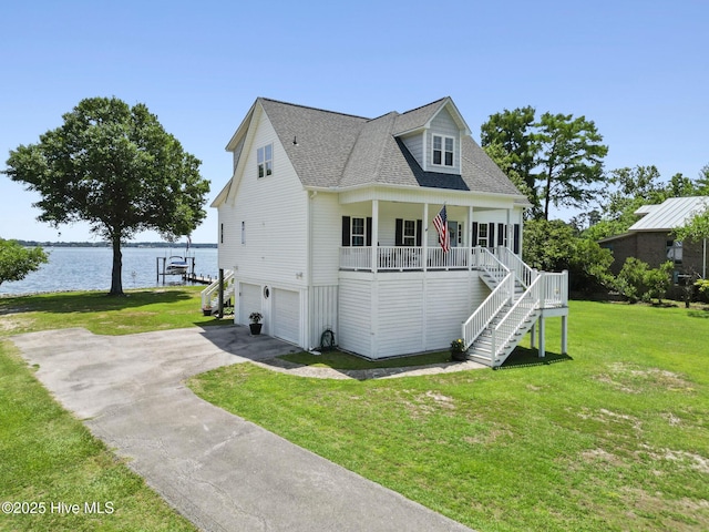 403 Harbor Dr, New Bern, NC 28560 - raised beach house featuring stairs, driveway, an attached garage, a water view, and a porch