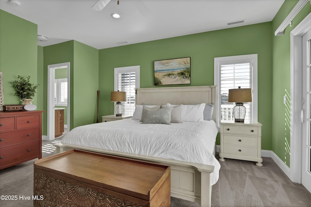 630 Saint Joseph St Unit 200, Carolina Beach, NC 28428 - carpeted bedroom with multiple windows, baseboards, and a ceiling fan