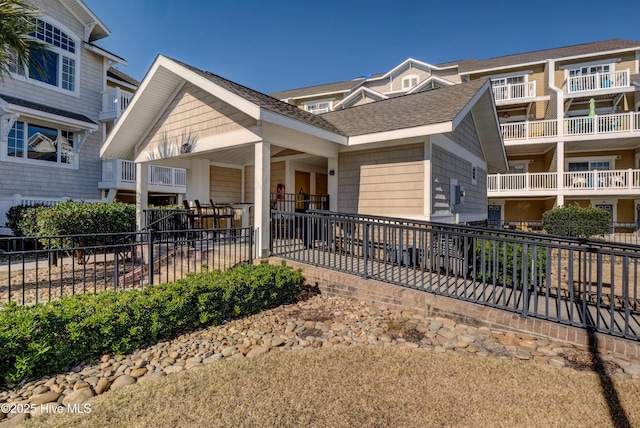 630 Saint Joseph St Unit 200, Carolina Beach, NC 28428 - view of front of house with a shingled roof