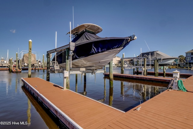 630 Saint Joseph St Unit 200, Carolina Beach, NC 28428 - dock featuring boat lift and a water view