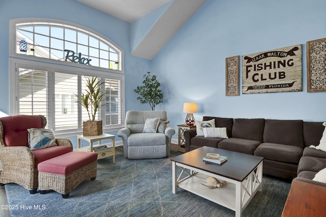 630 Saint Joseph St Unit 200, Carolina Beach, NC 28428 - living room featuring plenty of natural light and a towering ceiling