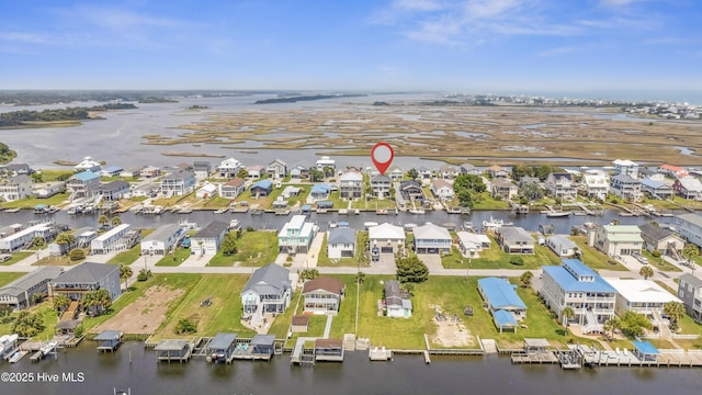 9089 W 9th St, Surf City, NC 28445 - aerial view of property and surrounding area featuring a large body of water and nearby suburban area