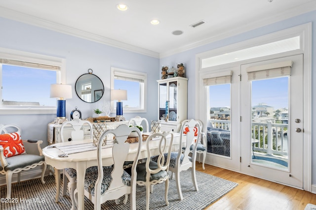 9089 W 9th St, Surf City, NC 28445 - dining room with crown molding, light wood-style flooring, and recessed lighting