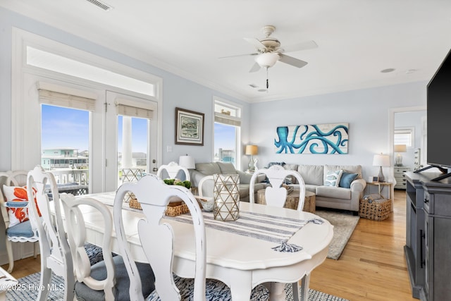 9089 W 9th St, Surf City, NC 28445 - dining area featuring ceiling fan, crown molding, and light wood-type flooring