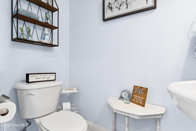 9089 W 9th St, Surf City, NC 28445 - half bath featuring toilet and baseboards