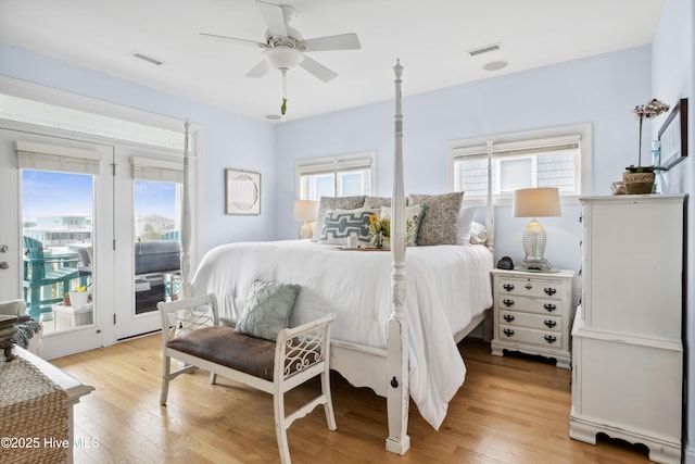 9089 W 9th St, Surf City, NC 28445 - bedroom featuring access to outside, light wood-style flooring, and ceiling fan