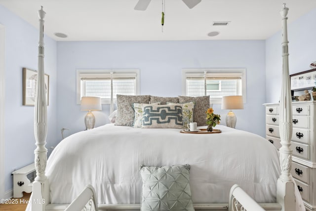 9089 W 9th St, Surf City, NC 28445 - bedroom featuring multiple windows and a ceiling fan
